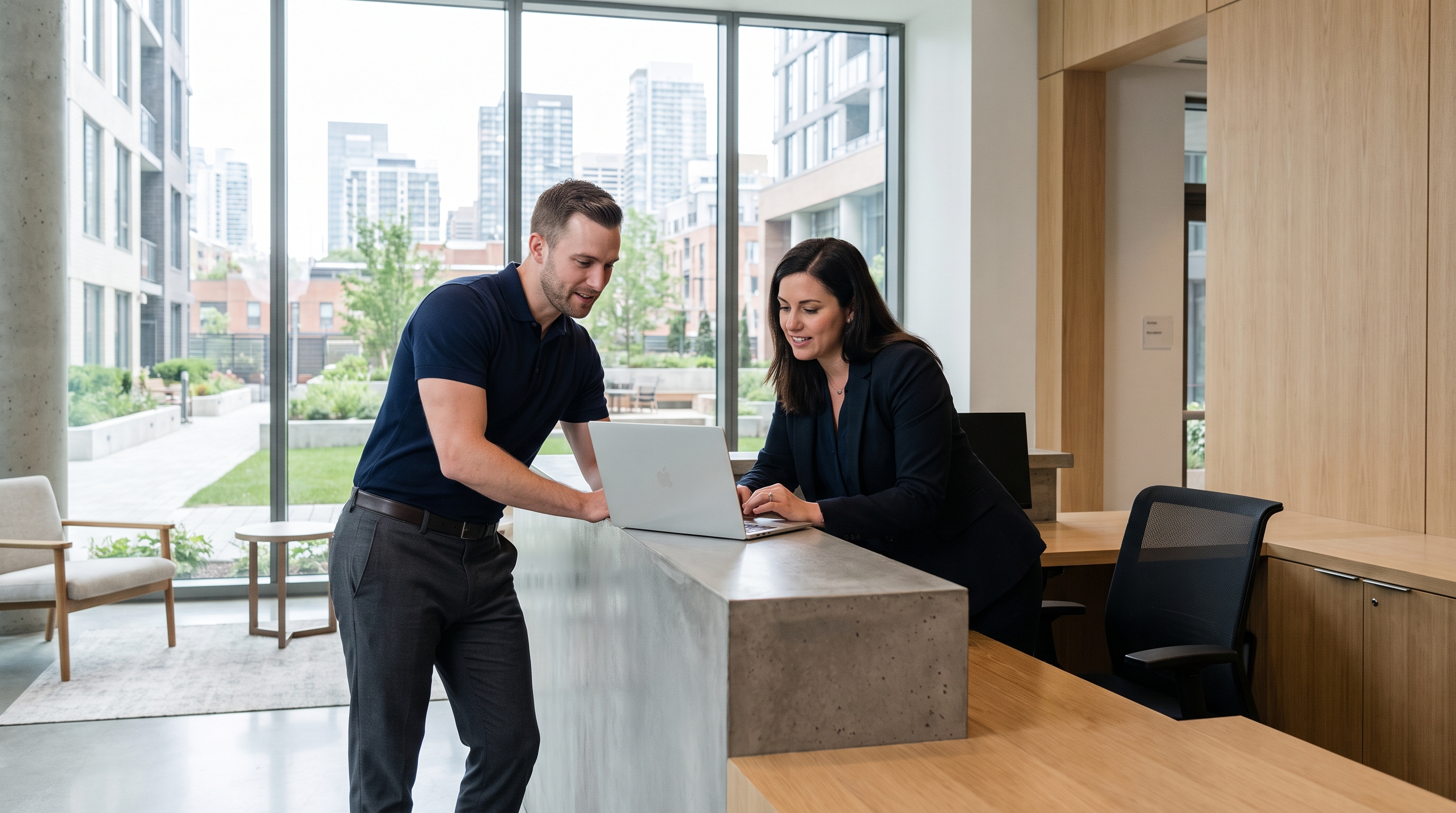 Technology specialist reviewing system information with a property manager