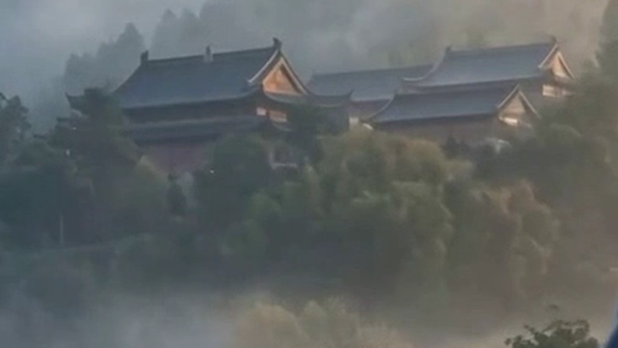 Crop of the 1080p frame enlarged 2x: soft trees and a blurry temple roof